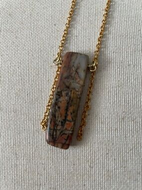 Brown, black, orange, and beige stone dangle chain necklace